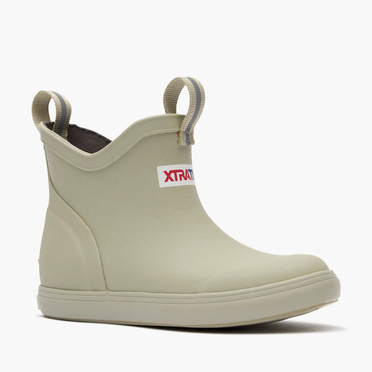 XTRATUF Kids' Ankle Deck Boot in stone color, showing the waterproof, slip-resistant design & pull tabs.