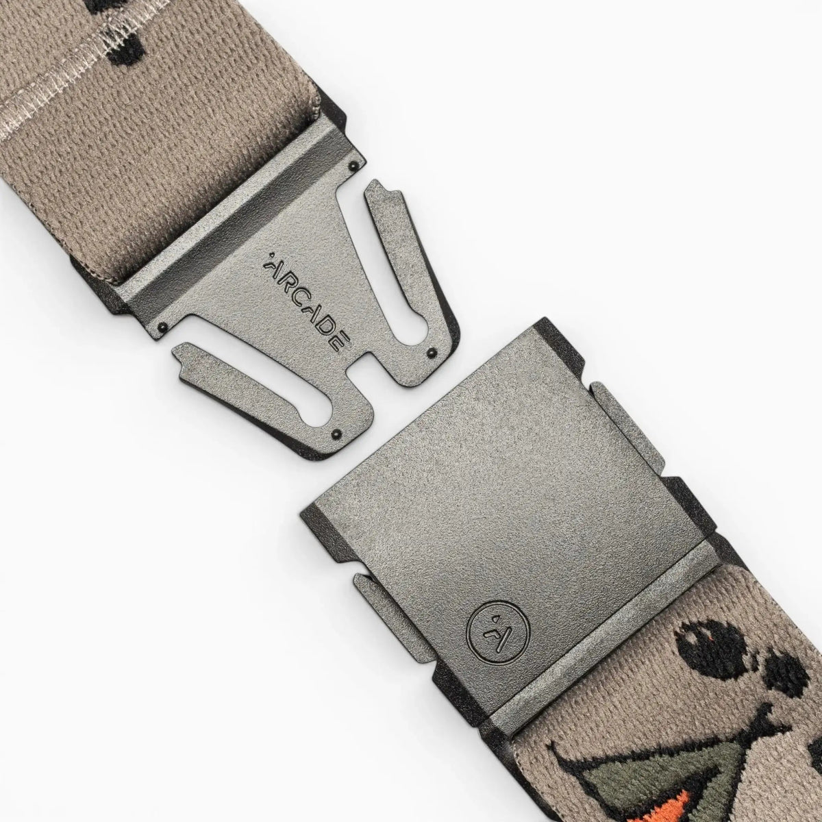 Arcade Belts Get Outside Stretch Belt with unfastened grey buckle and a tan patterned elastic strap.