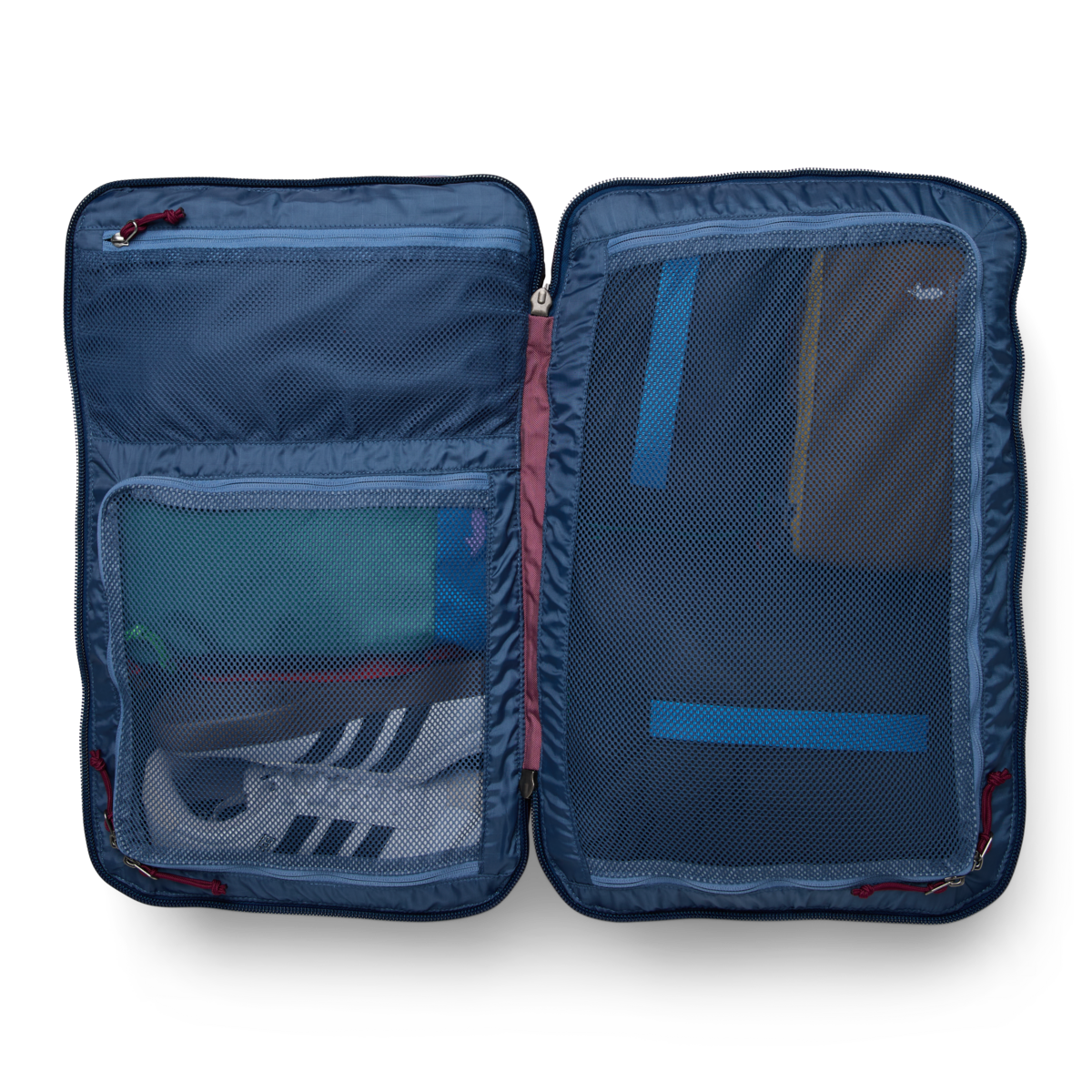 Cotopaxi Allpa 35L Travel Pack open, showing organized interior with mesh pockets holding shoes and essentials