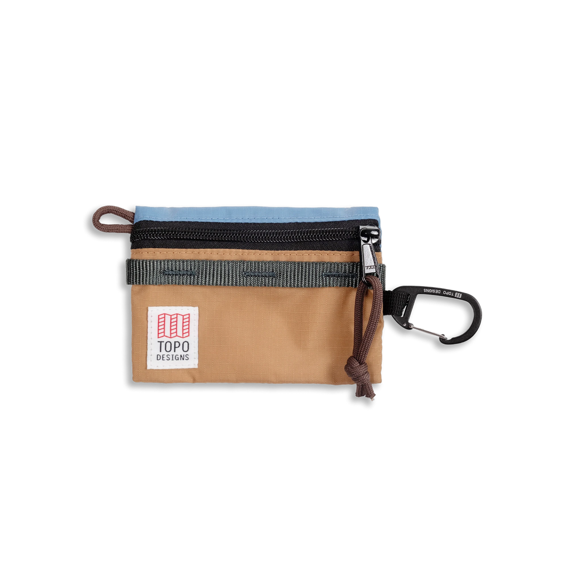Topo Designs Mountain Accessory Bag with light blue, tan, and black panels, a zipper closure, logo, and carabiner clip.