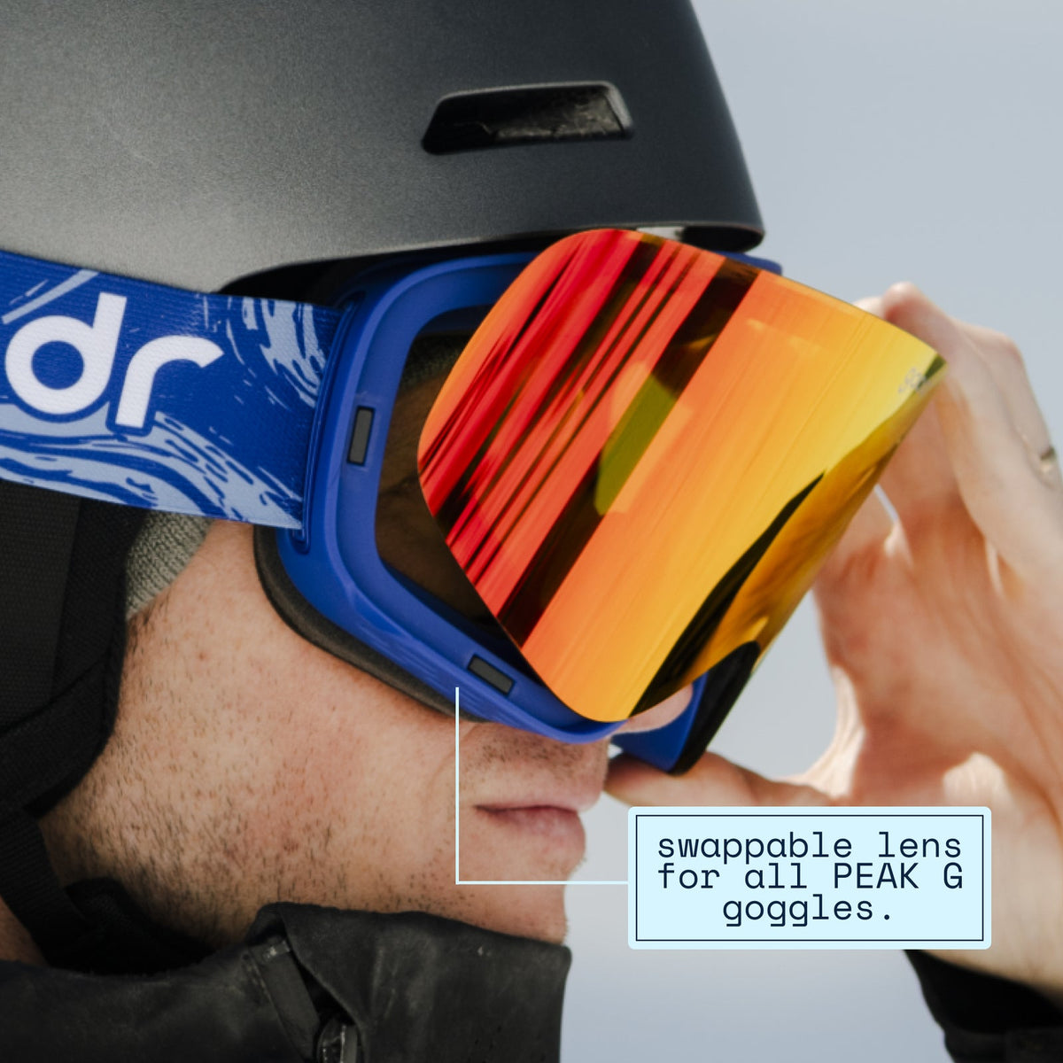 Chili Chill | goodr goggles on a person, showing the swappable orange/red mirrored lens being changed.