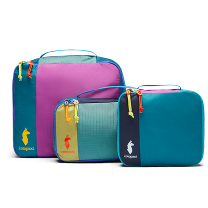 Cotopaxi Cubo Packing Travel Bundle: Three vibrant, multicolored packing cubes in different sizes for organized travel.