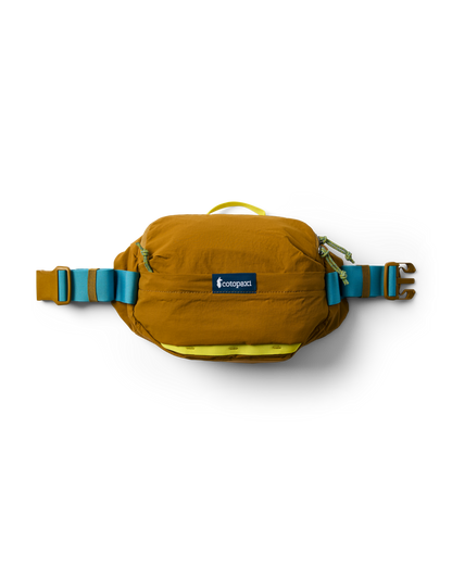 Cotopaxi Empacable 3L Sling in brown, featuring blue and yellow straps and green zipper pulls, studio shot.
