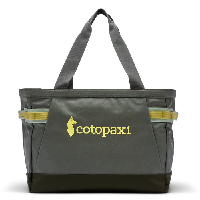 Allpa 30L Gear Hauler Tote by Cotopaxi in dark green with yellow logo and accents, front view on white background.