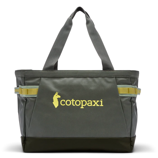Allpa 30L Gear Hauler Tote by Cotopaxi in dark green with yellow logo and accents, front view on white background.