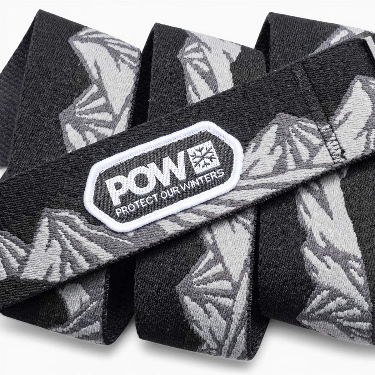POW x Joseph Toney Belt | Arcade Belts - Black belt with grey mountain pattern and 'Protect Our Winters' logo patch.