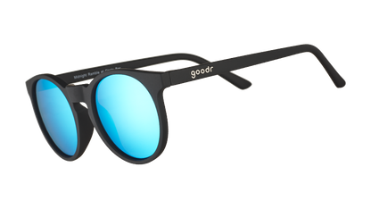 goodr Midnight Ramble at the Circle Bar sunglasses with matte black frames and vibrant blue mirrored lenses