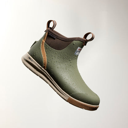 XTRATUF Men's Ankle Deck Boot Sport in olive, waterproof and covered in water droplets, showcasing its durable design.