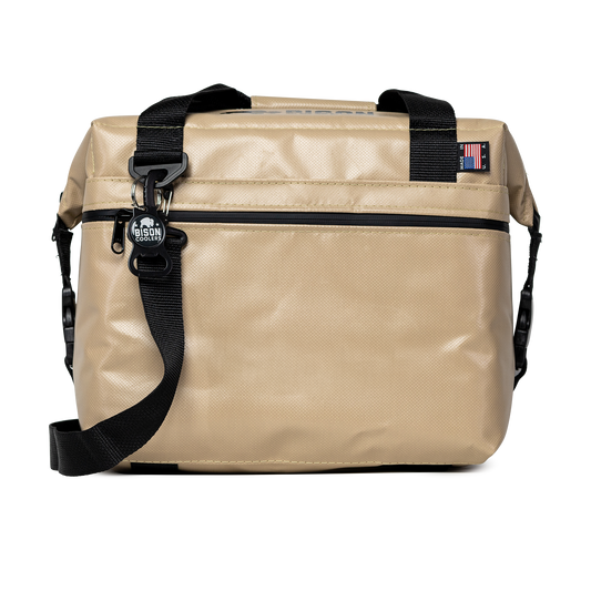 Tan Bison Coolers 12-Can SoftPak Standard cooler with black straps, bottle opener, and Made in USA tag.