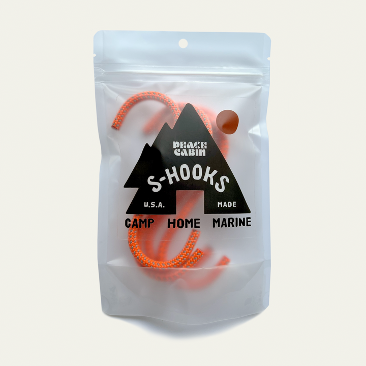 Media Mercantile Utility Hanging Hooks: orange S-hooks in clear pouch with 'Peace Cabin S-HOOKS' label. Ideal for camp, home, marine.