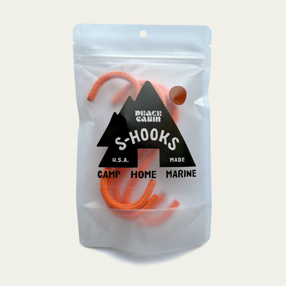 Media Mercantile Utility Hanging Hooks: orange S-hooks in clear pouch with 'Peace Cabin S-HOOKS' label. Ideal for camp, home, marine.