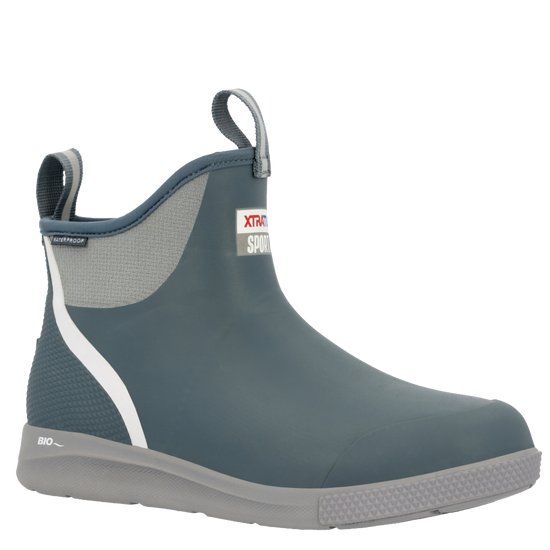 XTRATUF Men's Ankle Deck Boot Sport in Stormy Blue. Waterproof ankle boots with white stripe, grey sole & pull tabs.
