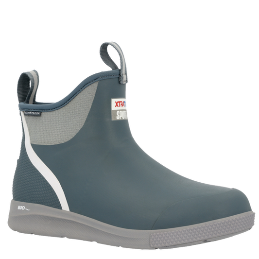 XTRATUF Men's Ankle Deck Boot Sport in Stormy Blue. Waterproof ankle boots with white stripe, grey sole & pull tabs.