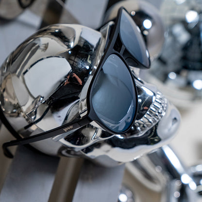 goodr Add the Chrome Package sunglasses with dark gray lenses on a shiny chrome skull.