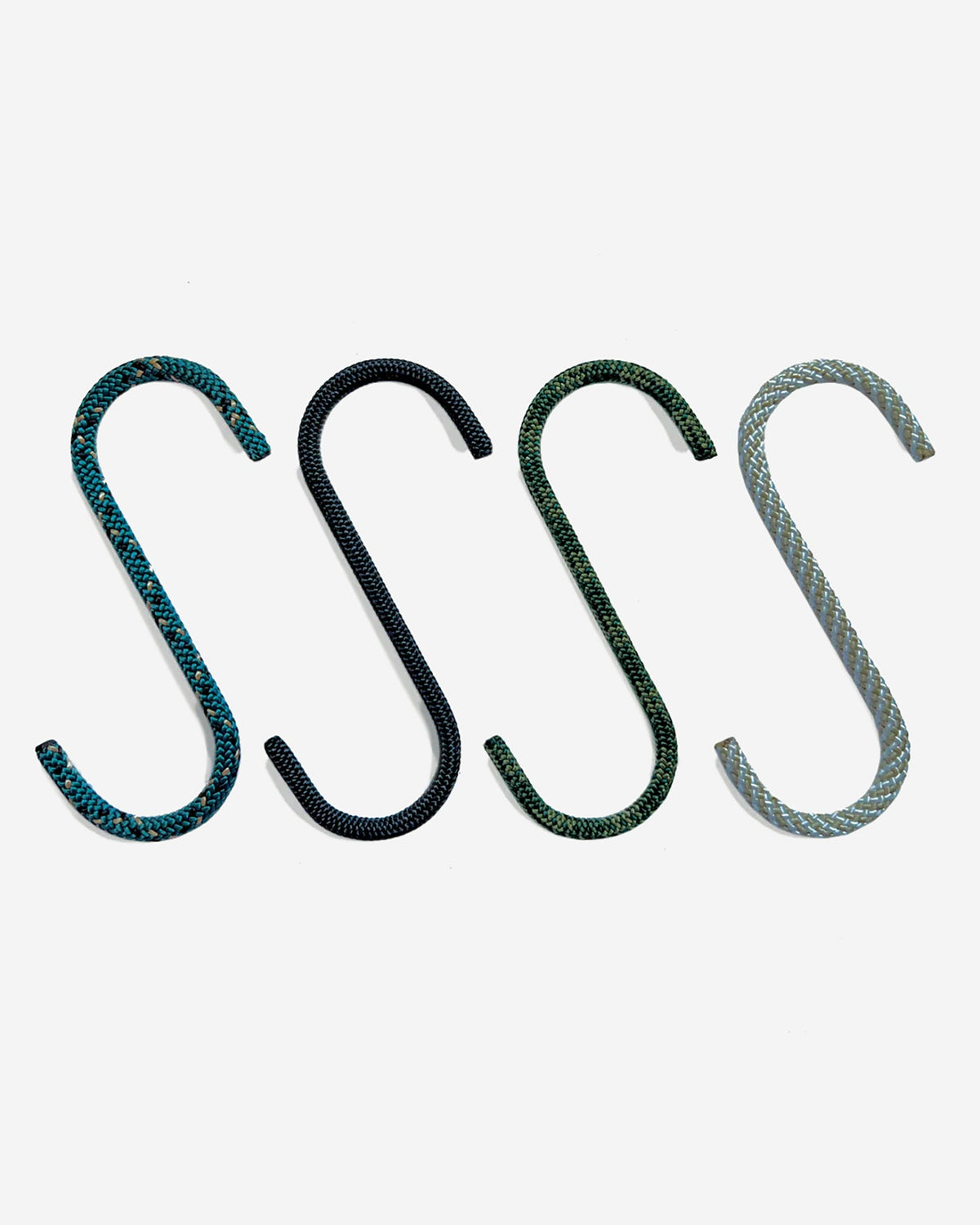 Media Mercantile Utility Hanging Hooks 4 Pack. Four S-shaped rope hooks in teal, black, dark green, and light gray.