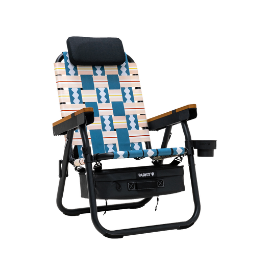 Eclipse PARKIT folding recliner chair with blue, white, peach woven geometric fabric, wooden armrests, black headrest, storage bag, and cup holder.