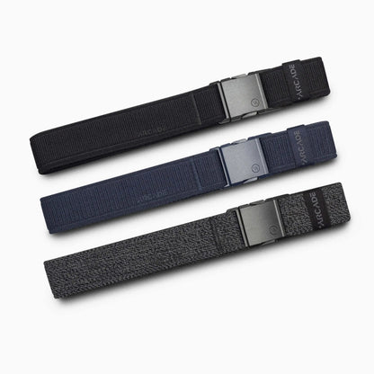 Arcade Belts Twilight Stretch Belt in black, navy blue, and dark grey heather, laid flat on a white background.