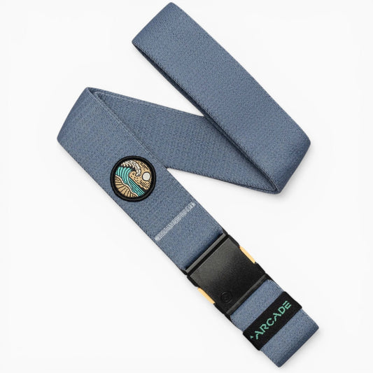 Arcade Belts Save the Waves Stretch Belt in blue, featuring a distinctive wave and sun patch and a black buckle.