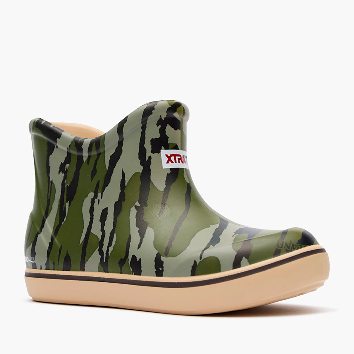 XTRATUF Kids' Mossy Oak Bottomland Ankle Deck Boot in green camo, featuring a tan sole.