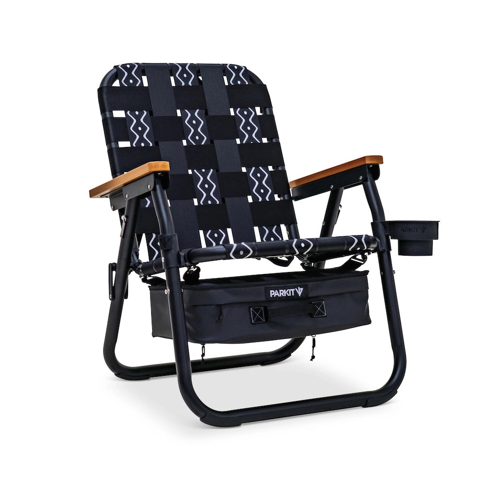 PARKIT Voyager Outdoor Chair with black and white patterned fabric, wooden armrests, under-seat storage, and cup holder.