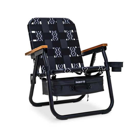 PARKIT Voyager Outdoor Chair with black and white patterned fabric, wooden armrests, under-seat storage, and cup holder.