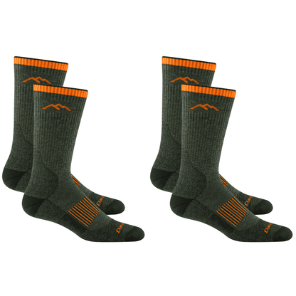 Two pairs of Darn Tough Men's Hunting Boot Midweight Socks in dark green with orange accents and mountain logo.