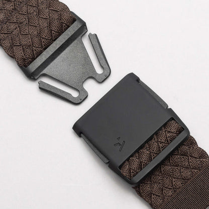 Close-up of the unfastened black buckle and brown woven strap of the Arcade Belts Futureweave Stretch Belt