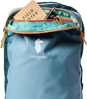 Cotopaxi Allpa Mini 20L Travel Pack showing the top zippered compartment with a Field Notes notebook and a pen inside.