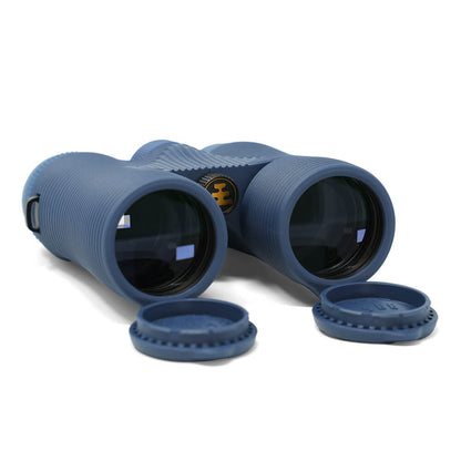 Field Issue 8x42 Binoculars by Nocs Provisions in dark blue, with lens caps, on a white background.