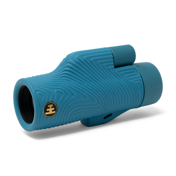 Nocs Provisions Field Tube 32mm Monocular in blue, featuring a textured grip and gold logo on a white background.