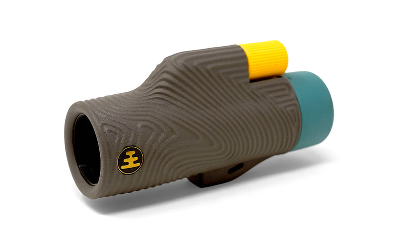 Nocs Provisions Field Tube 32mm Monocular in grey with textured grip, yellow focus wheel, and teal eyepiece cap
