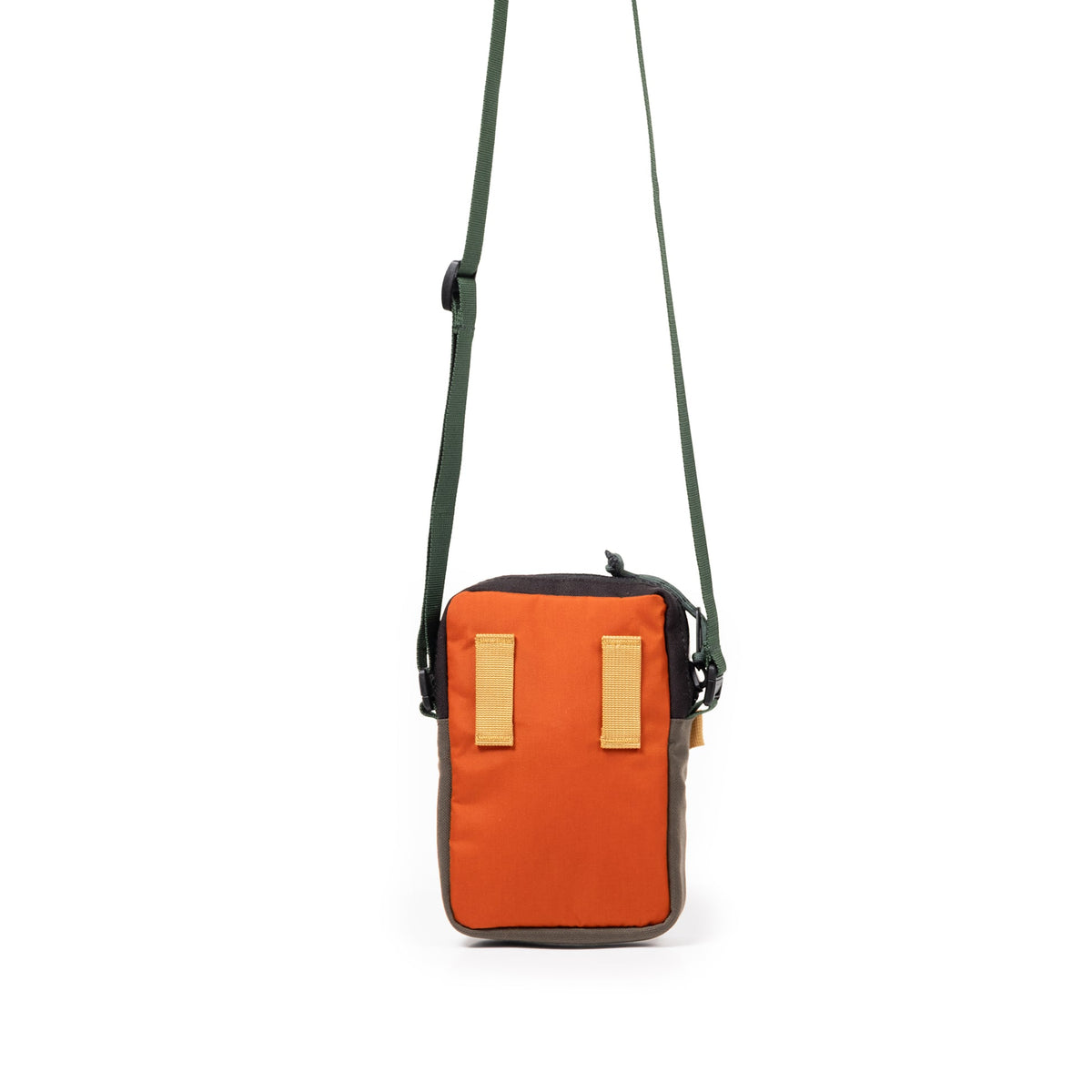 Topo Designs Mini Shoulder Bag in orange, black, and olive green with a green strap, shown hanging.
