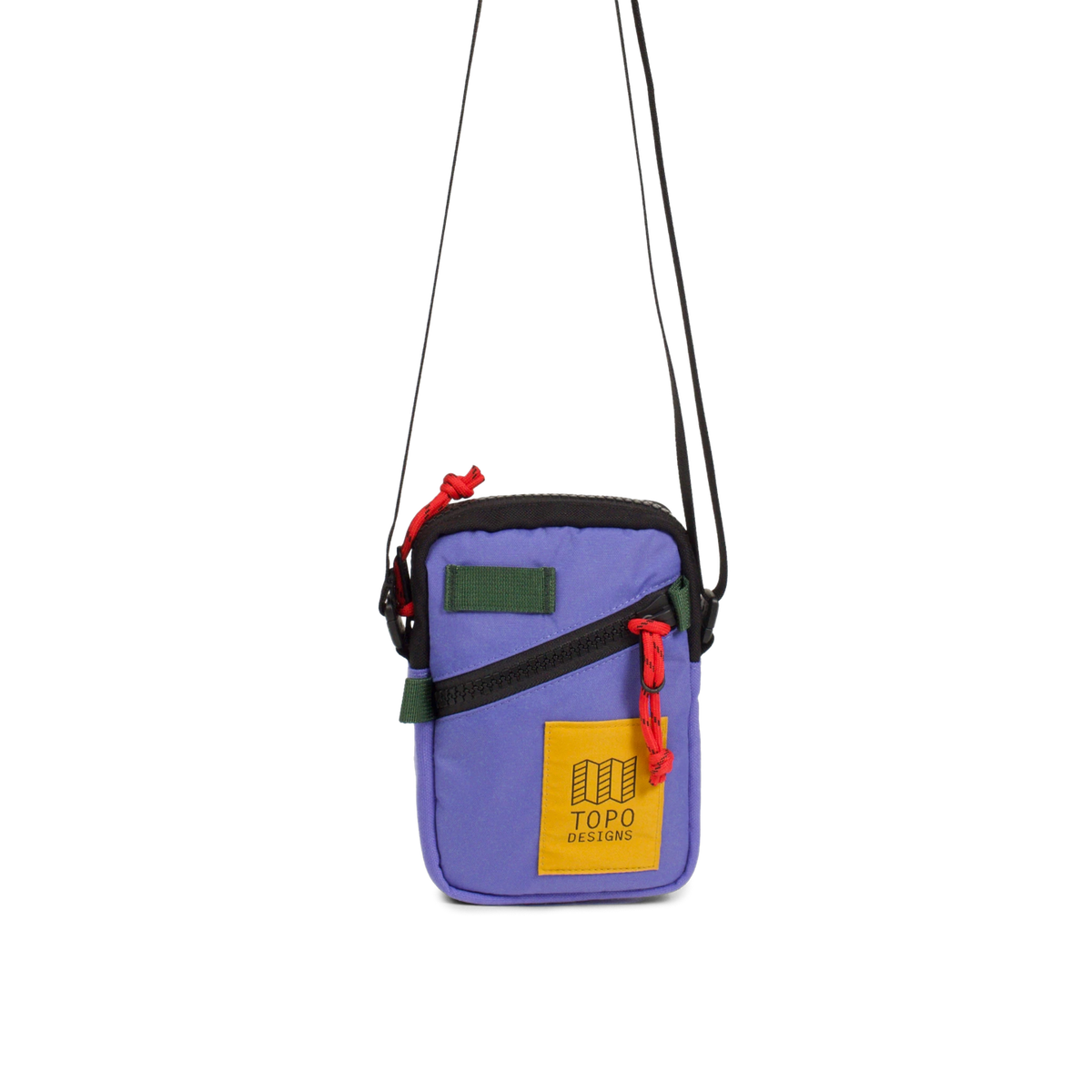 Topo Designs Mini Shoulder Bag in purple with black zipper, green accents, red cord pull, and yellow logo patch.
