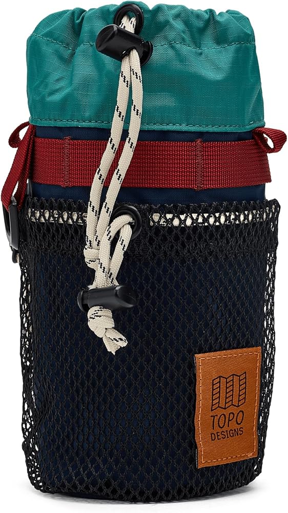 Topo Designs Mountain Hydro Sling in teal, red, and navy with a mesh pocket, drawstring closure, and white cord.