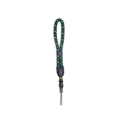 NocLoc Approach Wrist Loop by Nocs Provisions. A green and brown patterned rope wrist strap with black leather accents and buckle.