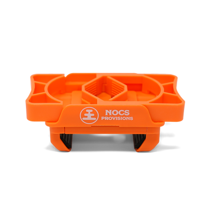 Nocs Provisions Photo Rig Smartphone Adapter, a bright orange phone mount with brand logo, designed for photography.