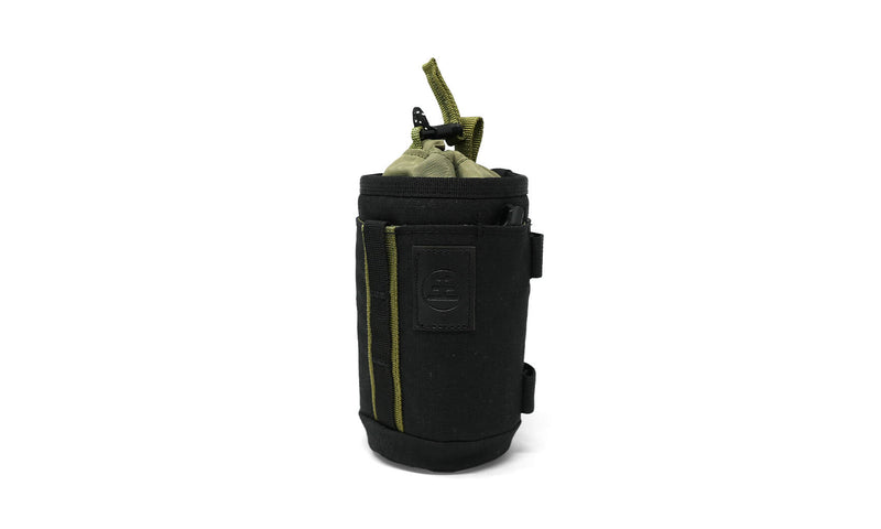 Nocs Provisions Tube Caddy, a black and olive green utility pouch with a drawstring closure, against a white background.