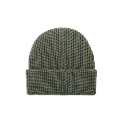 Topo Designs Waffle Knit Beanie in olive green, featuring a textured waffle knit pattern and a folded brim, shown flat.
