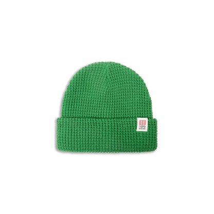 Green waffle knit beanie with a white Topo Designs label