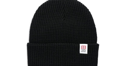Black Topo Designs Waffle Knit Beanie with a white brand label on the folded brim.