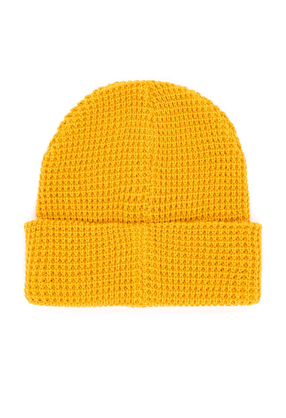 Topo Designs yellow Waffle Knit Beanie. Close-up of the textured, warm, and stylish headwear.
