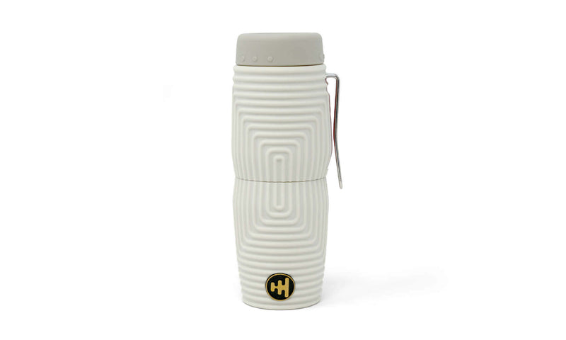 Nocs Provisions Zero Tube 10x25 Waterproof Monocular in white, featuring a textured body, gray cap, and metal clip.