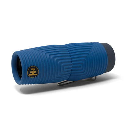 Nocs Provisions Zero Tube 10x25 Waterproof Monocular in blue with textured grip and clip on white background.