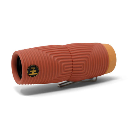 Nocs Provisions Zero Tube 10x25 Waterproof Monocular, reddish-brown with textured grip and orange cap, clip visible.